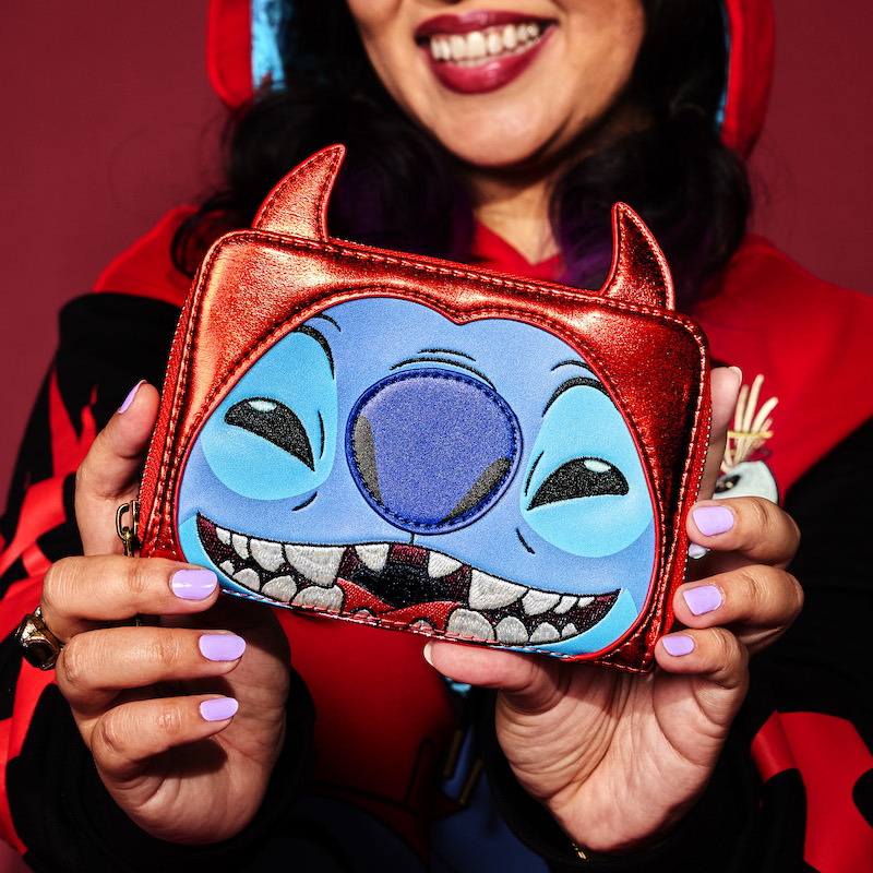 Woman holding out the Stitch Devil Cosplay Zip Around Wallet to camera, featuring Stitch from Disney's Lilo & Stitch dressed as a devil for Halloween